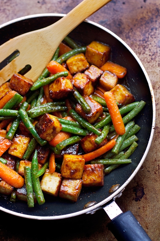 Sesame ginger tofu in pan with green beans and carrots