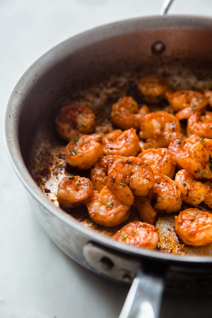 skillet with cooked chili butter shrimp 