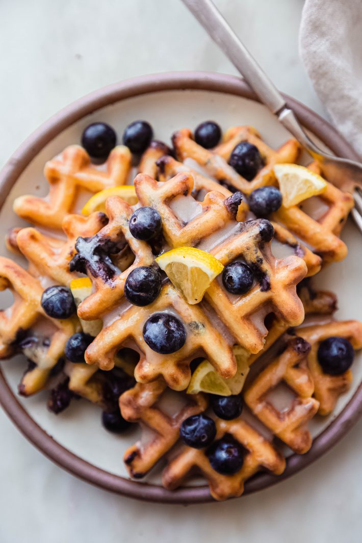 plate with stacked lemon blueberry waffles
