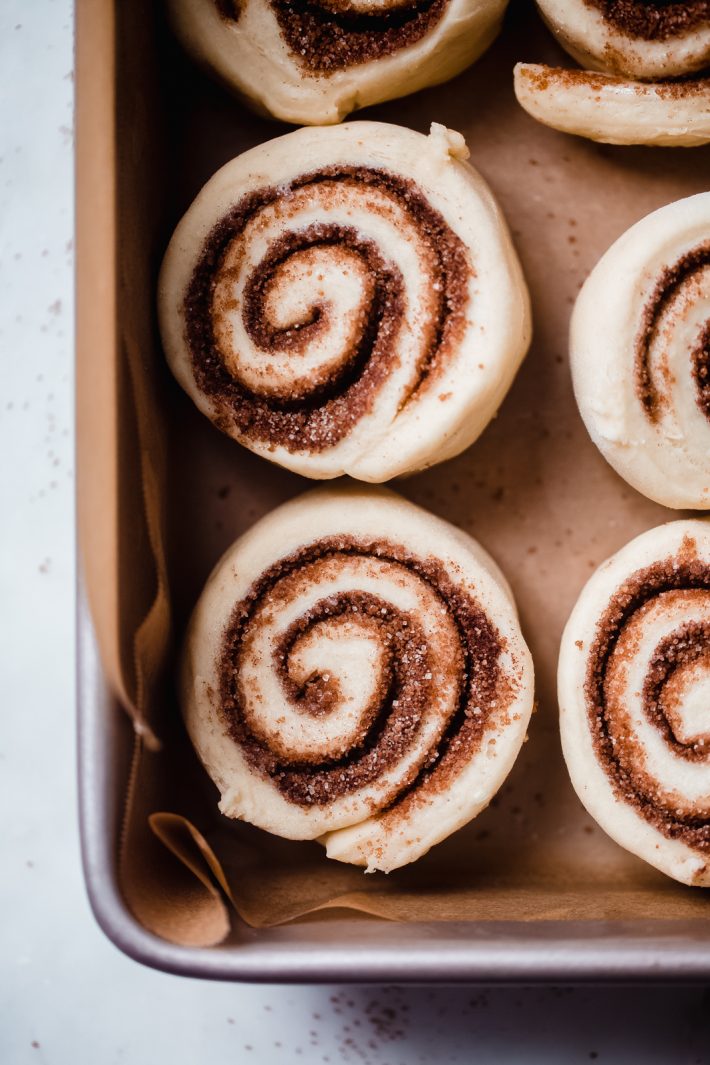 close up of unbaked cinnamon rolls showing texture of dough and cinnamon swirl