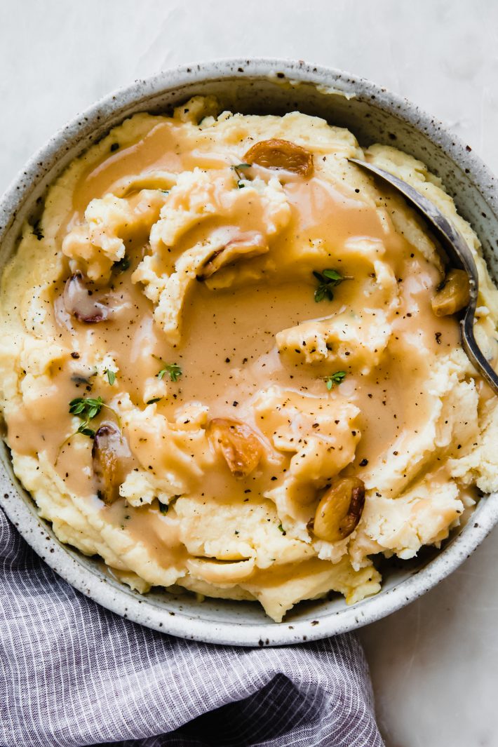 mashed potatoes topped with gravy 