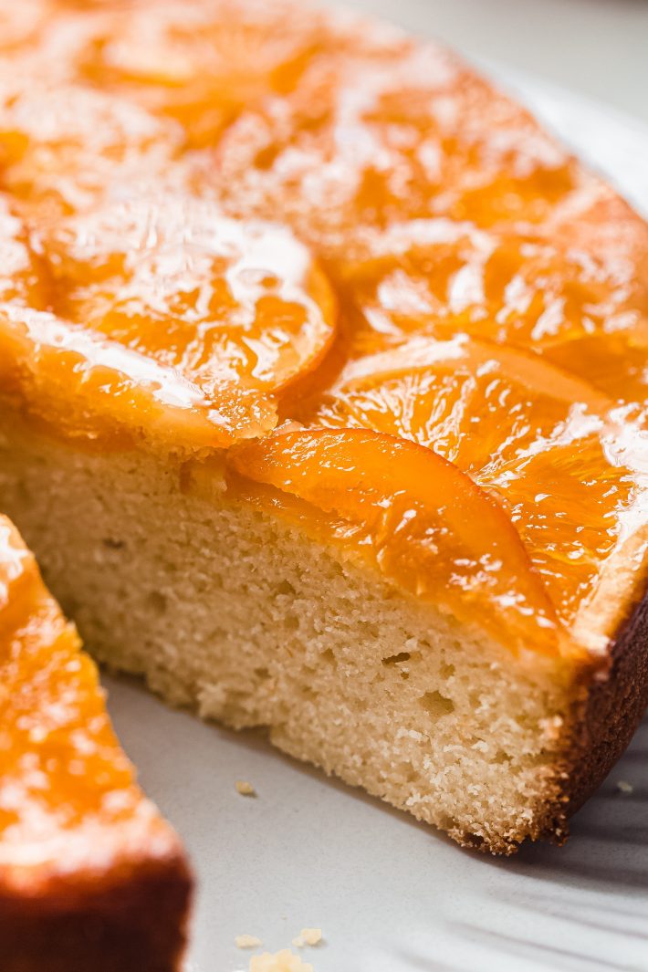 sliced cake showing inside texture and sliced candied oranges