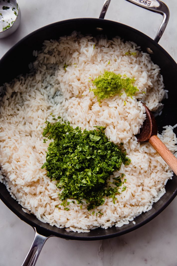 fluffy rice with cilantro and lime zest before mixing