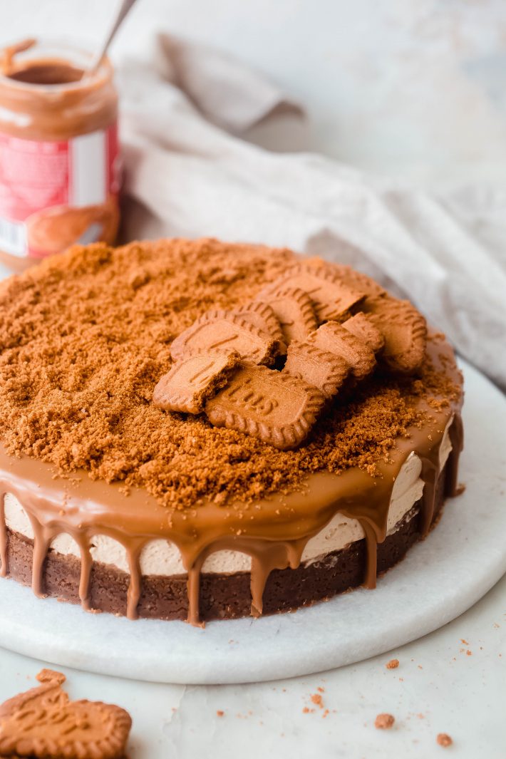 whole Biscoff Cheesecake on marble board