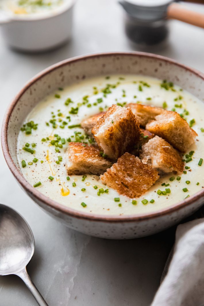 garlic potato soup topped with grilled cheese croutons