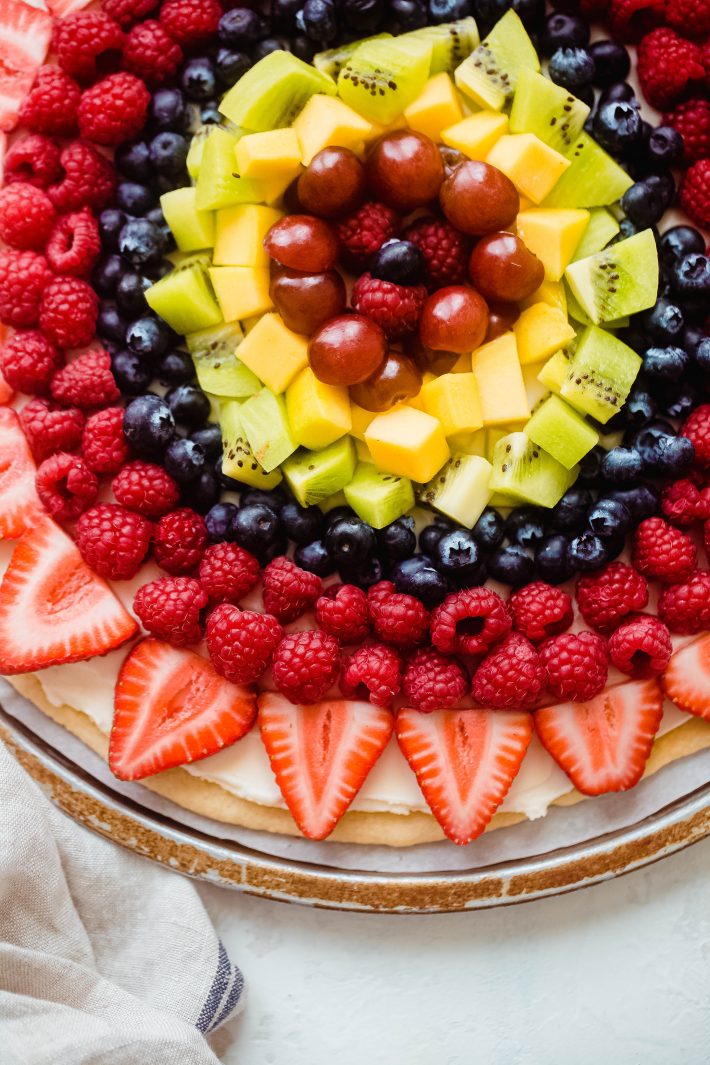fruit pizza topped with colorful fruit